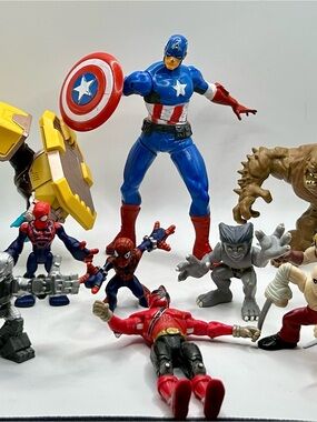 Bundle of action figures including Marvel, WWE and others